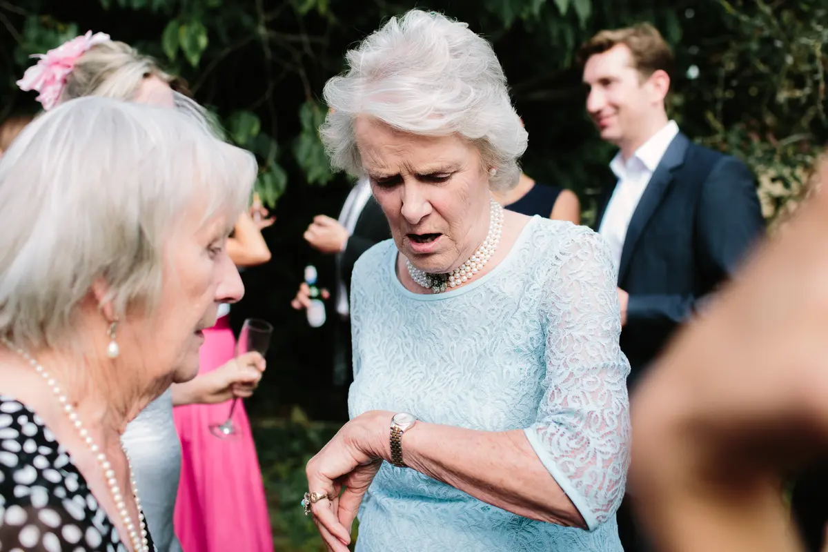 Wedding guest checking the time!