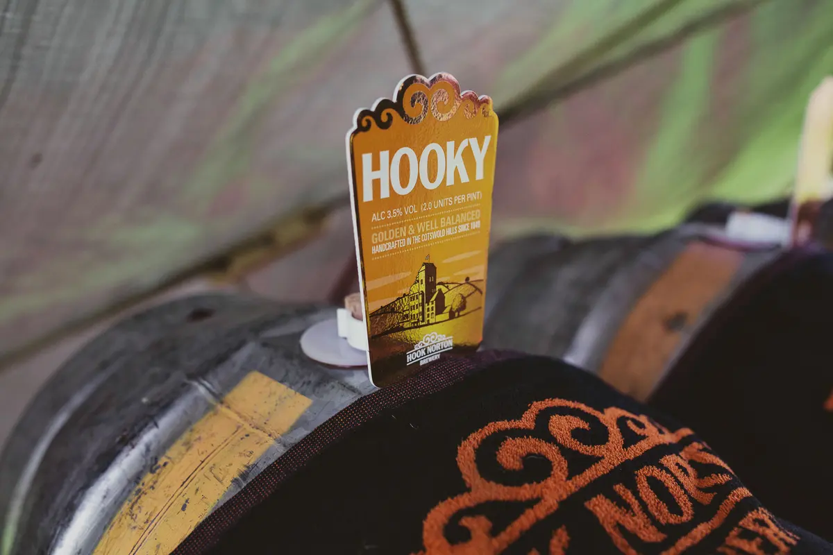 Pump clip for Hooky ale on a beer barrel under a canvas tent