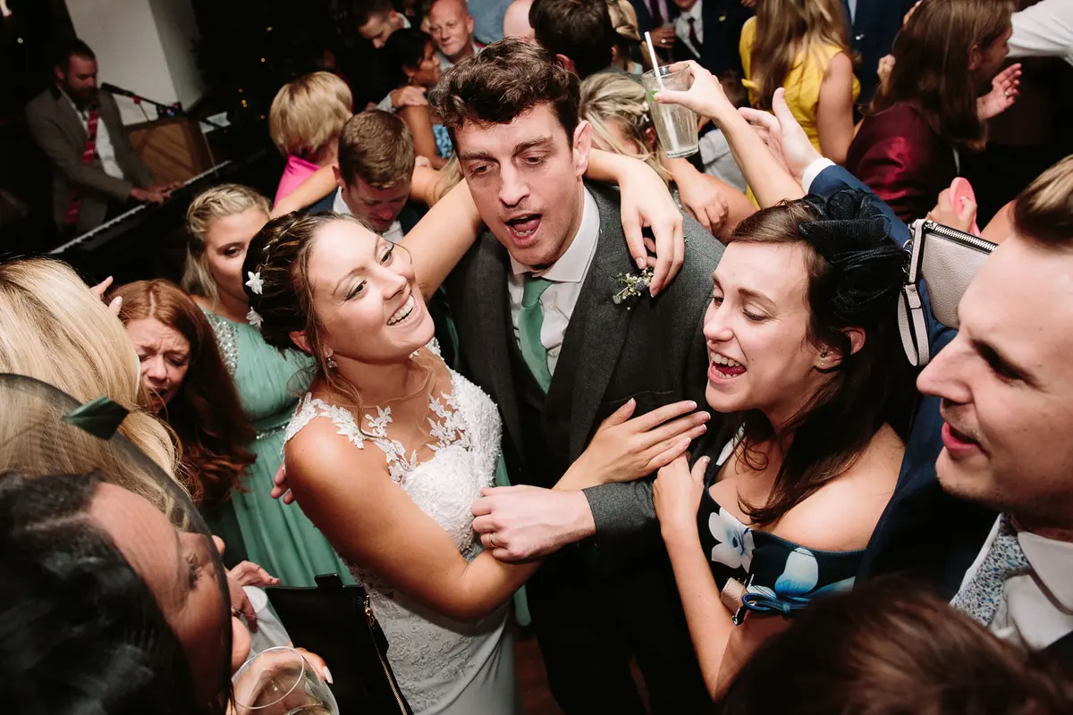 Bride and Groom on the dance floor surrounded by all their guests during an Oxford University Wedding