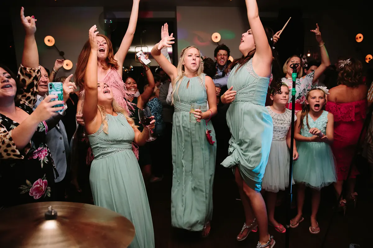 BRIDESMAIDS DANCEING AT A WEDDING