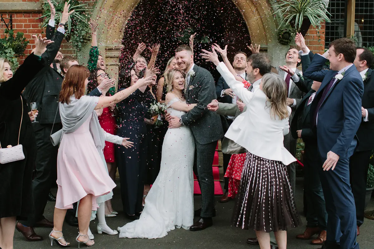 wedding photographer capturing the confetti shot