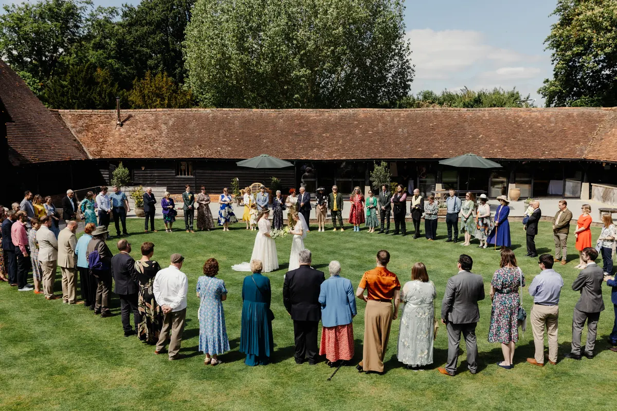 Outdoor wedding ceremony at Lains Barn in Oxfordshire