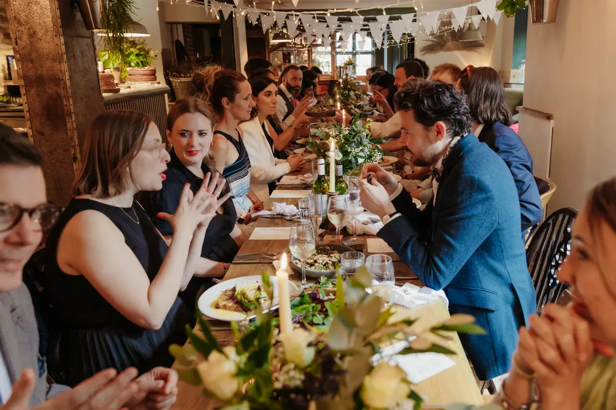 Wedding guests eating at Oxford Blue pub reception