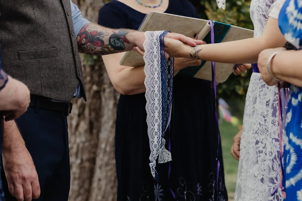 Handfasting ceremony at The Isis Farmhouse wedding venue Oxford