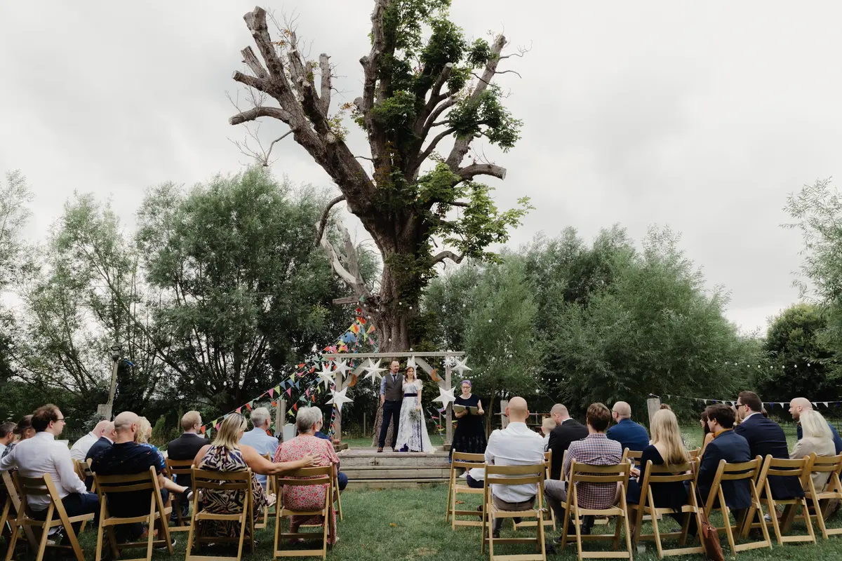 Outdoor ceremony at The Isis Farmhouse wedding venue Oxford