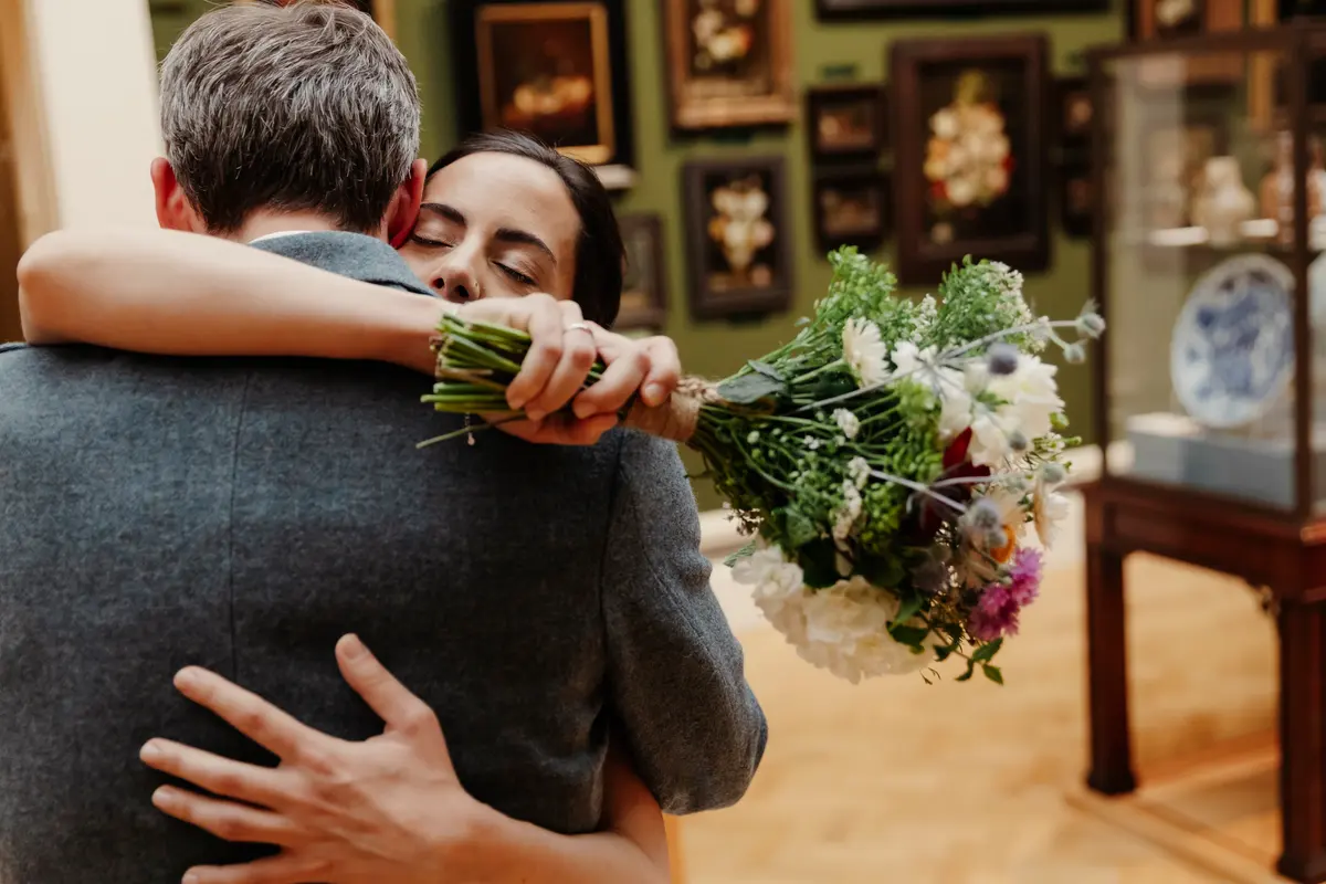 Wedding couple hugging at Ashmolean Museum Oxford