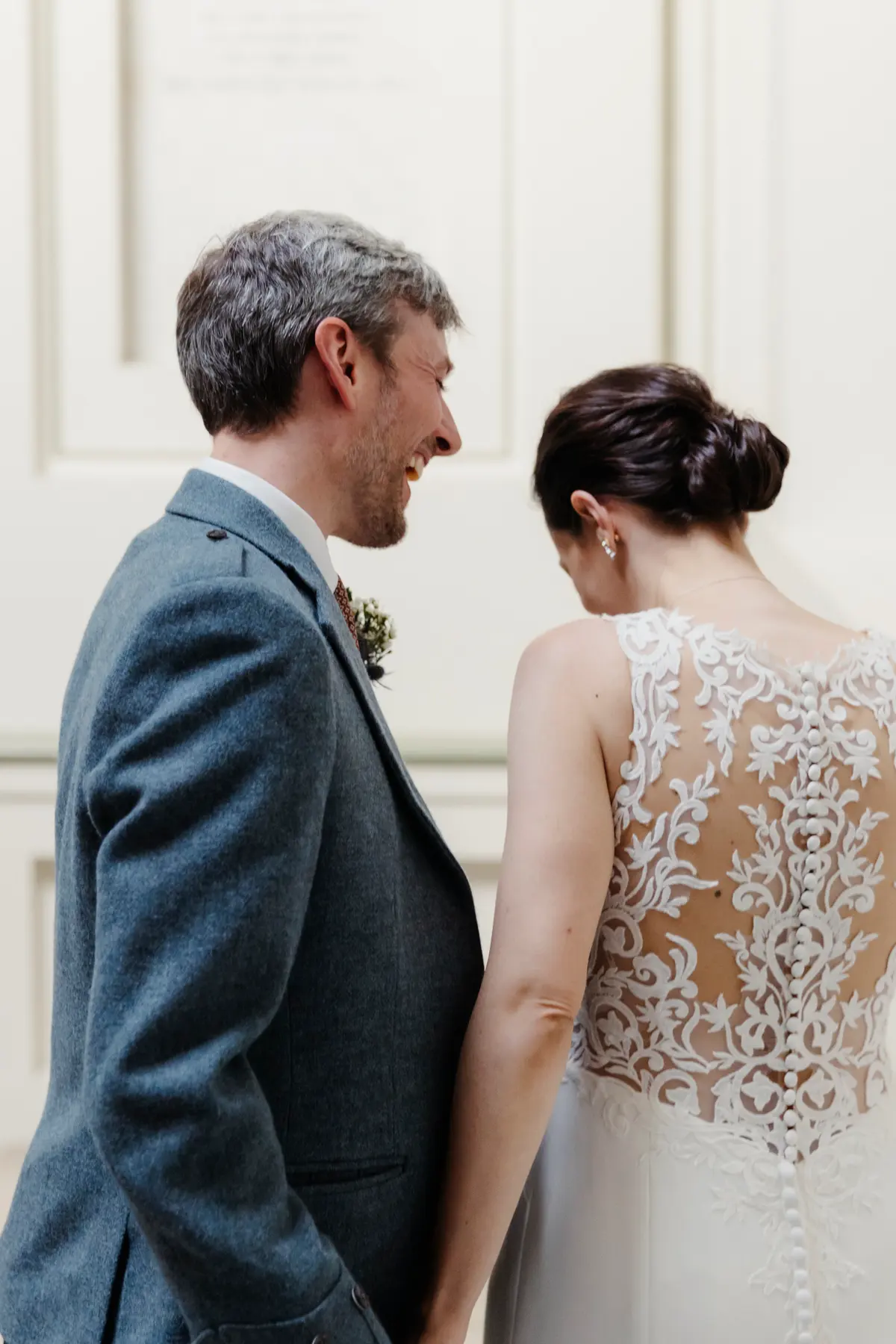 Wedding couple laughing at Ashmolean Museum Oxford